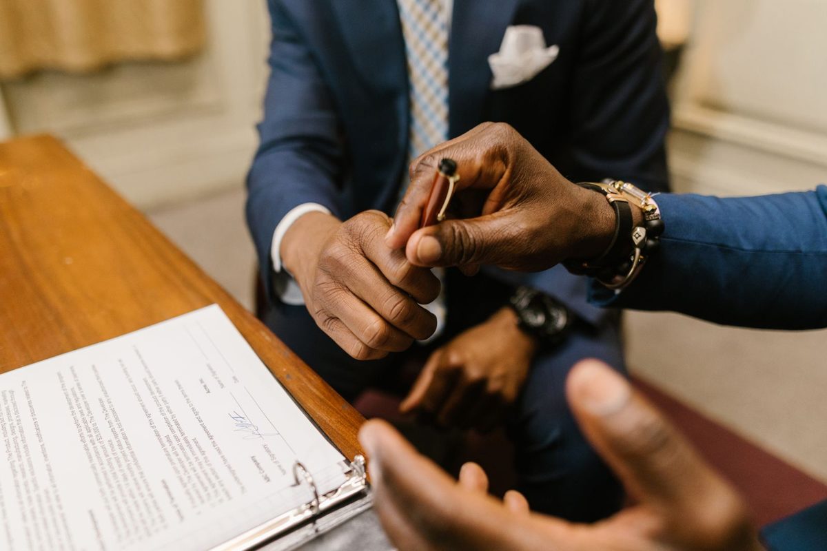 Client signing a legal agreement